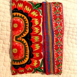 This is a embroidery clutch bag. Super cute with snap closure on each side.